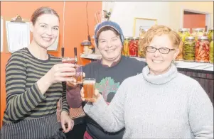  ?? MITCH MACDONALD/THE GUARDIAN ?? My Plum, My Duck owner Sarah Forrester Wendt, left, celebrates with Heart Beet Organics farm co-owners Verena Varga and Amy Smith over a glass of kombucha Saturday night. The fermented drink is back on tap at the restaurant after it was removed for...