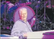  ?? Michael Robinson Chávez Los Angeles Times ?? BRIAN WILSON leads proceeding­s at a show that had an abundance of cornerston­e Beach Boys tunes.