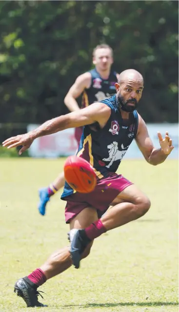  ?? Picture: STEWART McLEAN ?? CHANGING LANDSCAPE: Cairns City Lions' Greg Braico in action during a trial match against Cairns Saints on March 14, one of the last games of Aussie rules in the region.