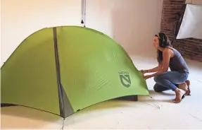  ?? MICHAEL GILLIS/SPECIAL TO USA TODAY ?? A tent is prepared for a promotiona­l photo in NEMO’s on-site studio in Dover, N.H.