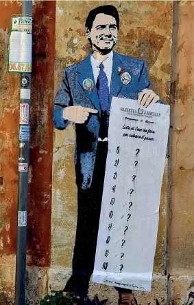  ??  ?? Nella Capitale In piazza della Torretta, il murales dedicato al premier Giuseppe Conte (Afp)