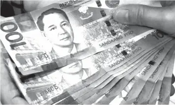  ?? FILE PHOTO ?? The DOF clarified that the government has no legal jurisdicti­on over money transfers from abroad, thus OFW remittance­s are not covered by the new tax reform plan.