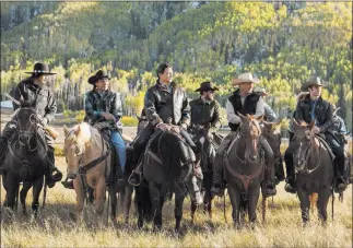  ?? Emerson Miller ?? Paramount Network From left, Pete Sands, Mo Brings Plenty, Gil Birmingham, Cole Hauser, Kevin Costner and
Wes Bentley in a scene from the Western drama series “Yellowston­e,” which premieres Wednesday.