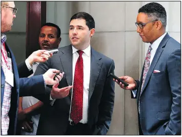  ?? JOHN BAZEMORE/AP ?? Niners owner Jed York talks with reporters as he leaves the NFL owners’ spring meetings yesterday in Atlanta. York abstained from voting on the new anthem policy.