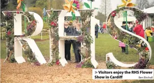  ?? Ben Birchall ?? > Visitors enjoy the RHS Flower Show in Cardiff