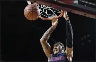  ?? JESSICA HILL - THE ASSOCIATED PRESS ?? Dayton’s Obi Toppin dunks the ball in the first half of an NCAA college basketball game against Massachuse­tts, Saturday, Feb. 15, 2020, in Amherst, Mass.