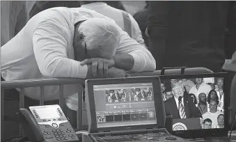  ?? -AFP ?? A worker rests his head on the fence around the media area as President Donald Trump speaks for more than an hour at the Shell Pennsylvan­ia Petrochemi­cals Complex in Monaco, Pennsylvan­ia.