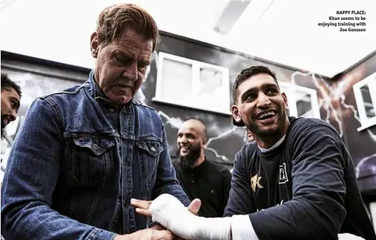  ?? Photo: MARK ROBINSON/MATCHROOM ?? HAPPY PLACE: Khan seems to be enjoying training with Joe Goossen