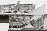  ??  ?? Posters show two contenders in Poland’s presidenti­al election runoff to be held Sunday.