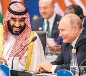  ?? PHOTO AFP ?? Le prince héritier saoudien Mohammed ben Salmane et le président russe Vladimir Poutine ont affiché leur camaraderi­e, hier, lors du G20.