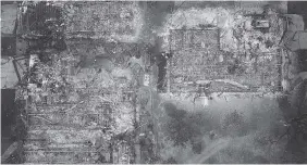  ?? NICK GIBLIN/DRONEBASE VIA AP ?? An aerial image shows homes destroyed by a wildfire in Santa Rosa, Calif., on Tuesday.