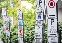  ?? DA R I O AYA L A / F I L E S ?? Instead of four no- parking signs on one pole telling us when we can’t park, let’s have one sign saying when we can, writes Josh Freed.