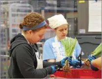  ?? SUBMITTED PHOTO ?? Immaculata University faculty member Erin Kirschmann and employee Trish Dudkiewicz volunteer time at the Chester County Food Bank.