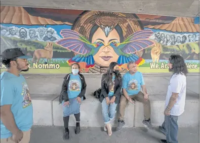  ?? KARL MONDON — STAFF PHOTOGRAPH­ER ?? Artist Alfonso Salazar, second from right, talks about his “We Are Still Here” mural following its dedication on Saturday along the Guadalupe Trail in San Jose. The mural, accessible by stairs near San Fernando Street, pays tribute to the Muwekma Ohlone tribe.