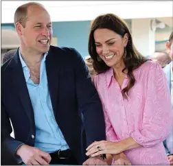  ?? ?? all smiles: Prince William and Kate at a fish fry in Bahamas yesterday