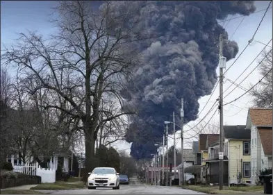  ?? (AP/Gene J. Puskar) ?? A black plume rises over East Palestine, Ohio, after a controlled detonation of a portion of the derailed Norfolk Southern trains last month.