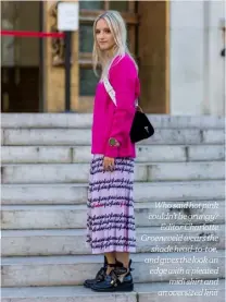  ??  ?? Who said hot pink couldn’t be grungy?
Editor Charlotte Groeneveld wears the
shade head-to-toe, and gives the look an edge with a pleated
midi skirt and an oversized knit