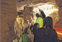  ?? CHELSEY LEWIS / CLEWIS@JOURNALSEN­TINEL.COM ?? Mike Sobush leads a group of Girl Scouts on a tour of New Hope Cave at Cherney Maribel Caves County Park in Cooperstow­n.