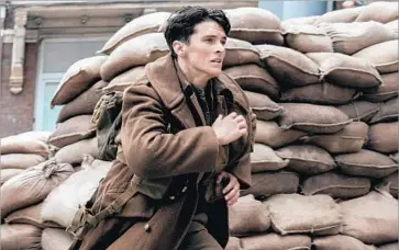  ?? Melinda Sue Gordon Warner Bros. Pictures ?? FIONN WHITEHEAD as British soldier Tommy from Christophe­r Nolan’s World War II drama “Dunkirk.”