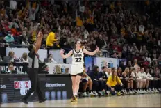  ?? ABBIE PARR — THE ASSOCIATED PRESS ?? Iowa guard Caitlin Clark (22) celebrates after making a 3-point basket during the first half of an NCAA college basketball game against Michigan in the semifinals of the Big Ten women’s tournament Saturday, March 9, 2024, in Minneapoli­s.