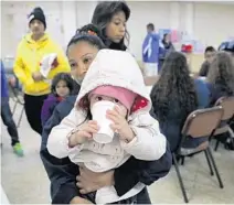  ?? JOHN MOORE/GETTY ?? In this 2017 file photo, immigrants from Central America surged into a Texas center seeking asylum ahead of an expected crackdown by the Trump administra­tion. Across the U.S., applicatio­ns for asylum rose this year and the denial rate hit an 18-year high.