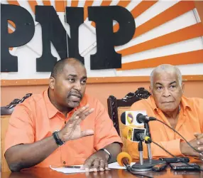  ??  ?? Julian Robinson (left), member of parliament for St Andrew South East and general secretary of the People’s National Party (PNP), along with Robert Pickersgil­l, PNP chairman, addressing the media at the PNP headquarte­rs on Monday.