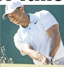  ?? Getty Images ?? WEEKEND WARRIOR: Tiger Woods, who is 2-over after two rounds, earned a chance to play Saturday and Sunday at the Wells Fargo Championsh­ip with a birdie putt on his last hole Friday.