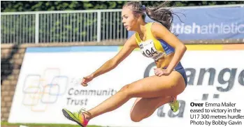  ??  ?? Over Emma Mailer eased to victory in the U17 300 metres hurdles. Photo by Bobby Gavin