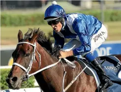  ?? PHOTO: GETTY IMAGES ?? Winx and jockey Hugh Bowman cruise home in the Queen Elizabeth Stakes at Randwick last Saturday.