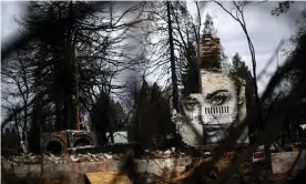  ??  ?? A mural painted on chimney at a home destroyed by the Camp fire. Photograph: Justin Sullivan/Getty Images