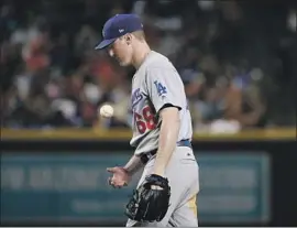  ?? Ross D. Franklin Associated Press ?? ROSS STRIPLING flips the ball after giving up an RBI single to Arizona’s Zack Greinke in the second inning, an inning Stripling couldn’t survive.