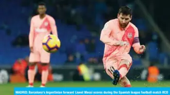  ??  ?? MADRID: Barcelona’s Argentinia­n forward Lionel Messi scores during the Spanish league football match RCD Espanyol against FC Barcelona at the RCDE Stadium in Cornella de Llobregat on Satueday. — AFP