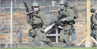  ?? THE CANADIAN PRESS/ FILES ?? An RCMP team responds to a reported shooting in Ottawa in October.