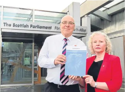  ??  ?? Asbestos Action manager John Fearn, who highlighte­d a new support booklet for those affected, with Fife MSP Claire Baker whose father died from asbestos-related cancer.