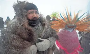  ?? GETTY IMAGES ?? Despite blizzard conditions, Military veterans march in support of “water protectors” Monday at Oceti Sakowin Camp on the edge of the Standing Rock Sioux Reservatio­n.