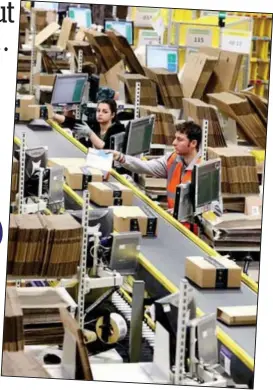  ??  ?? Gargantuan: This Amazon warehouse in Rugby employs hundreds