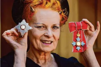  ?? Fiona Hanson/Associated Press 2006 ?? Dame Vivienne Westwood, an influentia­l fashion maverick, shows her insignia from Britain’s Prince Charles during an Investitur­e ceremony at Buckingham Palace in 2006.