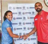  ?? PTI ?? Indian hockey team captain P. R. Sreejesh greets women hockey team captain Rani Rampal before leaving for the Asian Games in New Delhi on Monday.