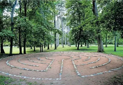  ?? MICHAEL SEARS / MILWAUKEE JOURNAL SENTINEL ?? The grounds of Rogers Memorial Hospital in Oconomowoc include a labyrinth to walk. See more photos at jsonline.com/business.