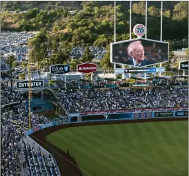  ?? JAE C. HONG — THE ASSOCIATED PRESS ?? A screen at Dodger Stadium shows late broadcaste­r Vin Scully during a tribute to him before a baseball game between the Los Angeles Dodgers and the San Diego Padres on Friday, Aug. 5, 2022, in Los Angeles.