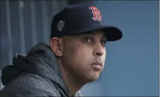  ?? DAVID J. PHILLIP ?? FILE - In this Oct. 28, 2018, file photo, Boston Red Sox manager Alex Cora waits for the start of Game 5of the baseball World Series between the Red Sox and Los Angeles Dodgers in Los Angeles. Cora was fired by the Red Sox on Tuesday, a day after baseball Commission­er Rob Manfred implicated him in the sport’s sign-stealing scandal.