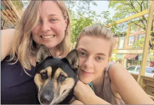  ?? SUBMITTED PHOTO ?? Kris Smith smiles alongside her daughter, Anna Smith, and their rescue pup, Zena, in downtown Kennett Square.