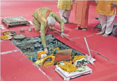  ??  ?? Indian Prime Minister Narendra Modi takes part in the groundbrea­king ceremony on Wednesday for a planned Hindu temple in the city of Ayodhya, Uttar Pradesh, at the site of a demolished 16th-century mosque.