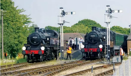  ?? John H Bird/ANISTR.COM ?? Ivatt ‘2MT’ 2-6-2Ts Nos 41313 and 41298 are seen at Havenstree­t on 28 May 2018 during the very successful ‘Three Ivatts’ gala on the Isle of Wight Steam Railway. The third Ivatt in question was ‘2MT’ 2-6-0 No 46447, the three locomotive­s being in the hands of the resident Ivatt Locomotive Trust. It was two days earlier that the author ‘scratched’ his last Ivatt for haulage, No 41313. The full list, including two in preservati­on, reads: 41204, 41222/23/24, 41230/34, 41241/49, 41284/87, 41290/94/95/98/99, 41312/13/16/19 and 41320.