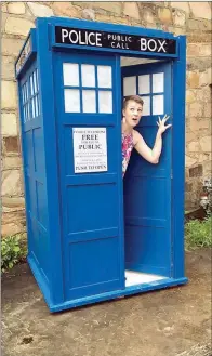  ?? SUBMITTED ?? Jenny Dunham of Clinton poses in the replica of the Doctor Who TARDIS machine, which was constructe­d by Charles Wilson, the city’s street foreman, and his daughter, Jancey. The idea came from Jason Hayes, executive director of the Clinton Area Chamber...