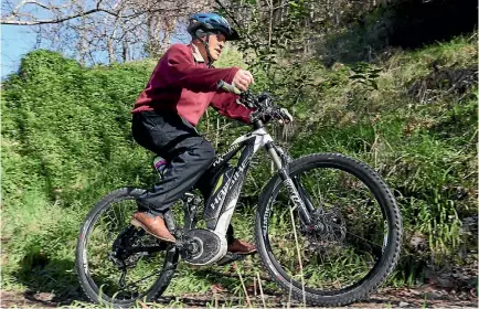  ?? PHOTO: MARION VAN DIJK/ FAIRFAX NZ ?? Tom Sharland, 79, using an e-mountain bike on a Maitai Valley track.