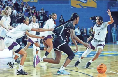  ?? PHOTOS BY WILLIAM BRETZGER/DELAWARE NEWS JOURNAL ?? Caravel’s Anaya Price, left, fouls Ursuline’s Jezelle “GG” Banks with 5.6 seconds left after Banks stole the ball in a tie game before her later free throw gave the Raiders a 49-48 win in the DIAA championsh­ip on Saturday at the Bob Carpenter Center. Caravel’s Chasity Wilson (1) moves in on defense after the sudden turnover.