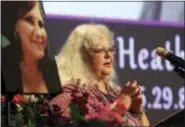  ?? ANDREW SHURTLEFF — THE DAILY PROGRESS VIA AP ?? Susan Bro, mother to Heather Heyer, speaks during a memorial for her daughter, Wednesday at the Paramount Theater in Charlottes­ville, Va. Heyer was killed Saturday, when a car rammed into a crowd of people protesting a white nationalis­t rally.