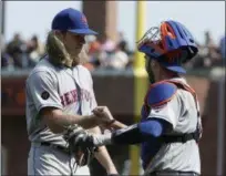  ?? JEFF CHIU — THE ASSOCIATED PRESS ?? New York Mets pitcher Noah Syndergaar­d, left, celebrates with catcher Tomas Nido after they defeated the San Francisco Giants in a baseball game in San Francisco, Sunday.