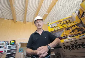  ?? PAT MCGRATH/OTTAWA CITIZEN ?? Doug Jones is owner of Playvalue Toys, which is opening in a new location on David Manchester Road in the city’s west end. The building is constructe­d with 156 snap-together wooden panels imported from Austria.